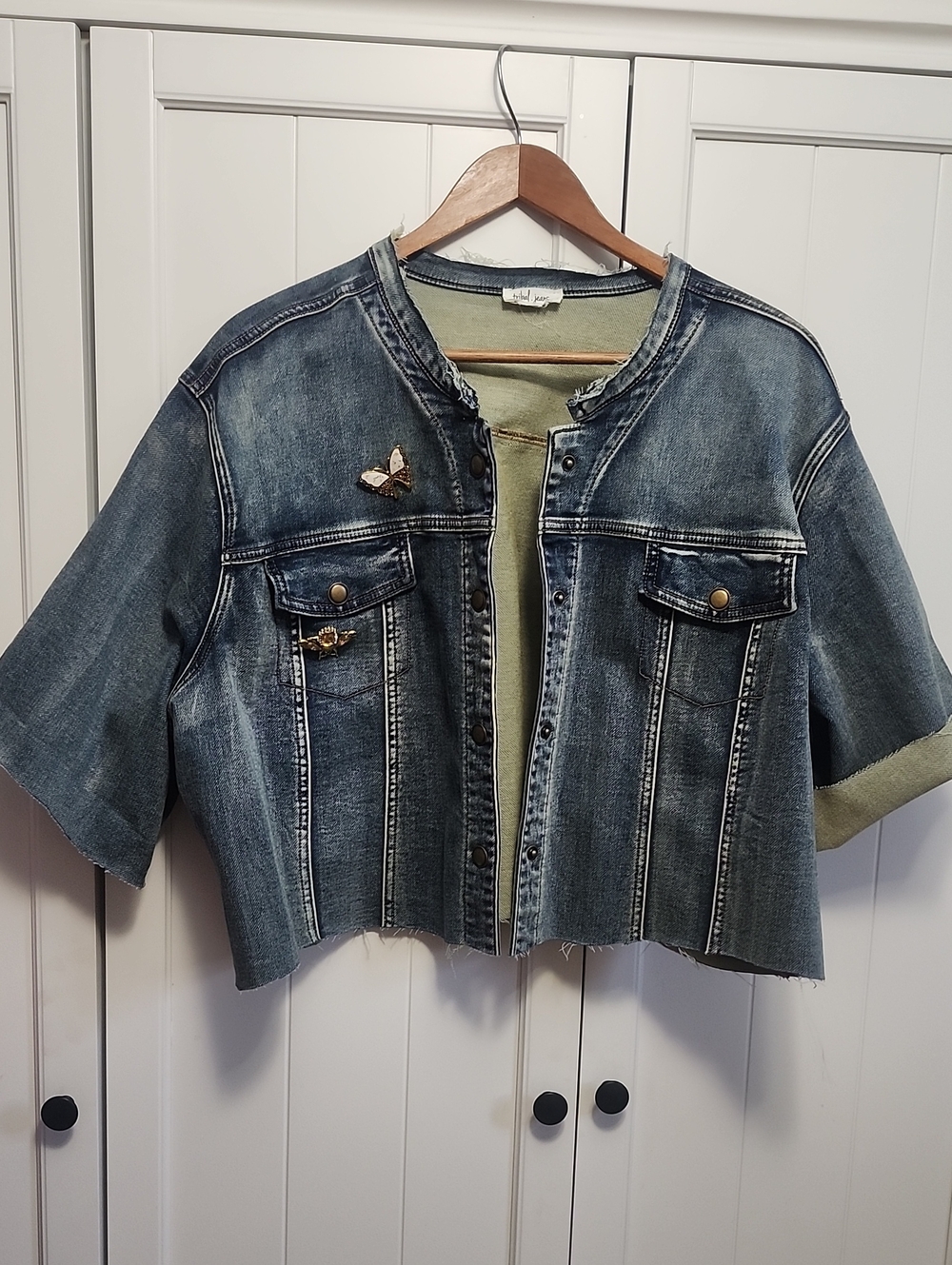 Repurposed cuffed snap Jean jacket and 2 brooches